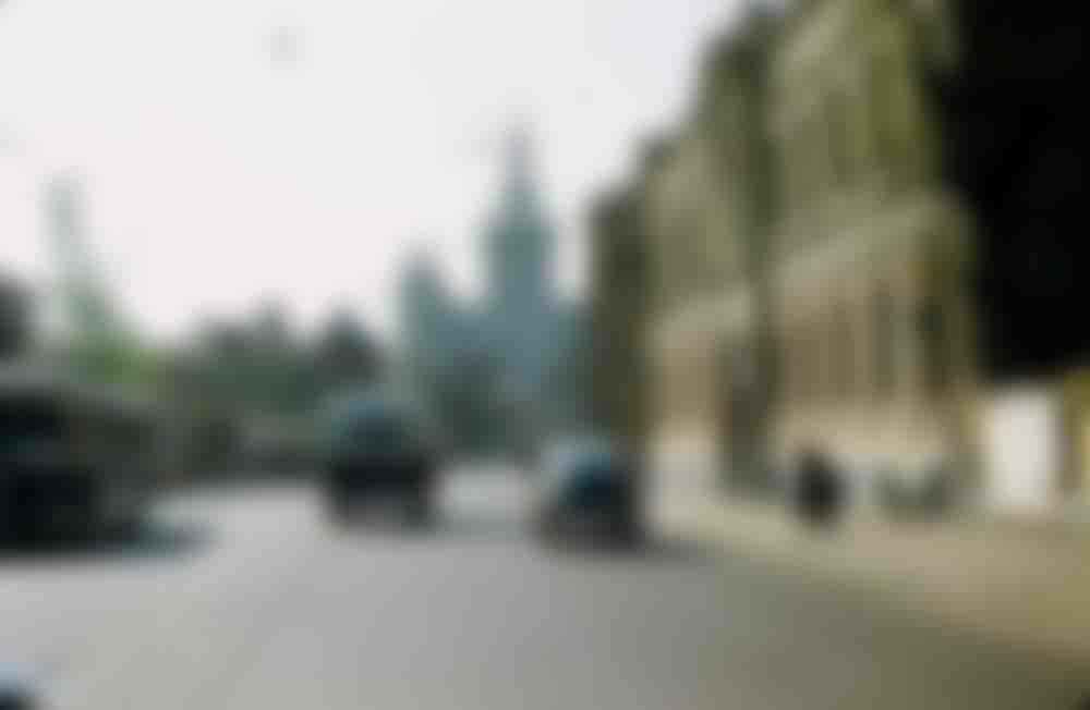 Driving up Moscow's Bolshaya Nikitskaya ulitsa, with the Kudrinskaya ploshchad skyscraper rising in the background.