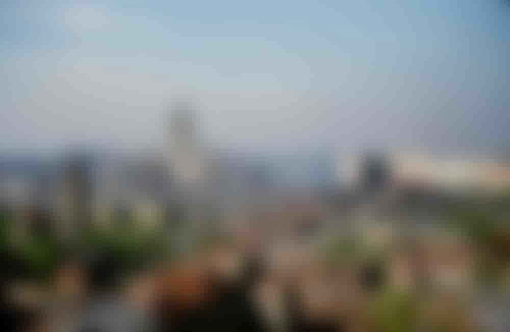 The Hotel Ukraina skyscraper as seen from the roof of the U.S. Embassy on Novinsky bulvar, Moscow. To the left is the Church of the Nine Martyrs of Cyzicus.